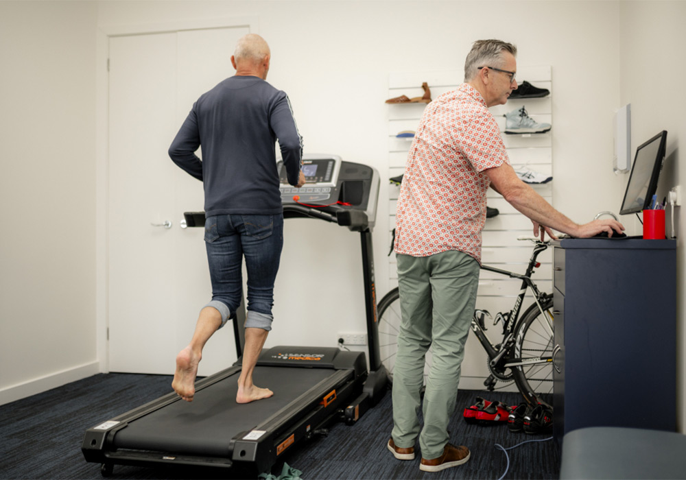 Heel Pain – the causes man on treadmill getting assessed by podiatrist