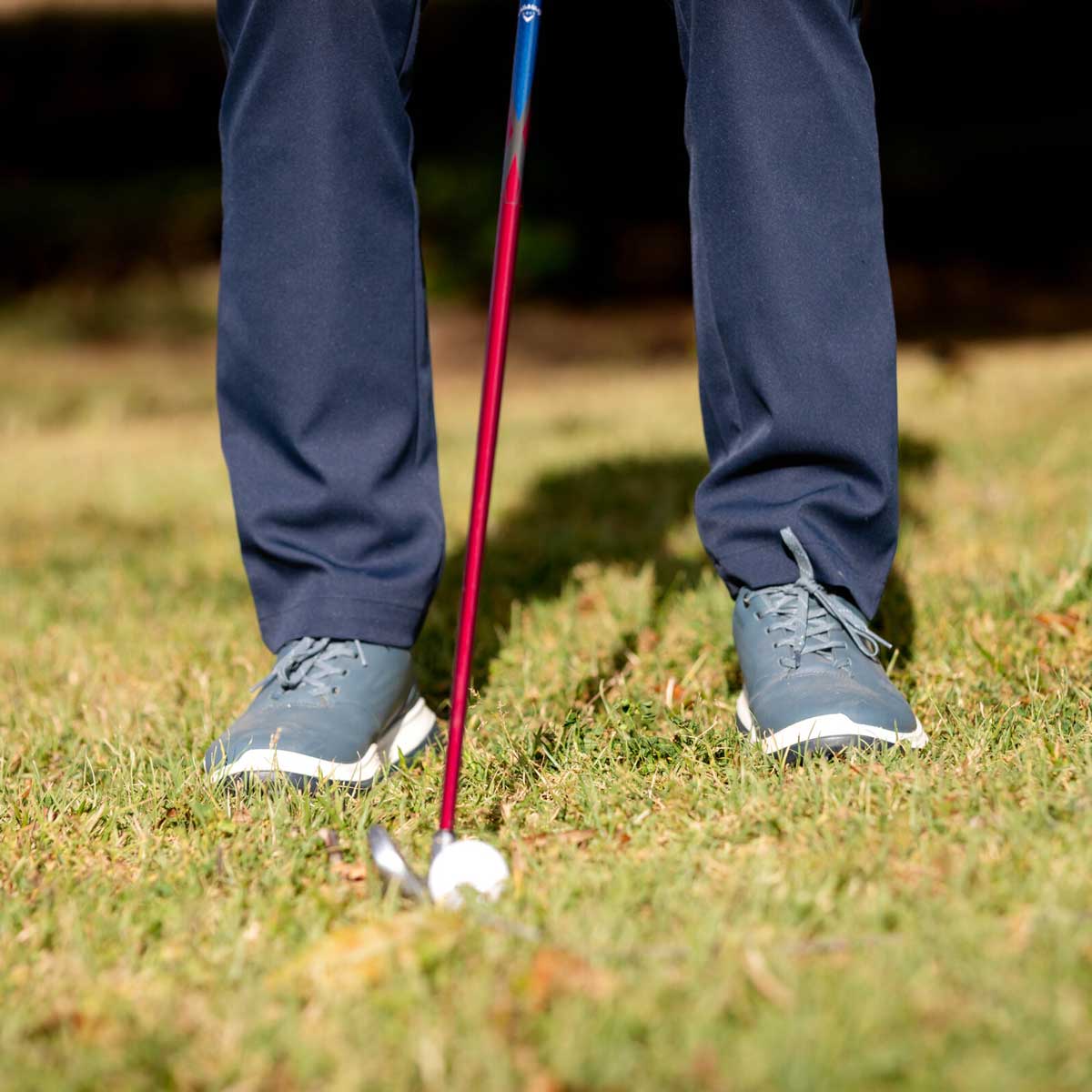 Close up of golfer with club and ball
