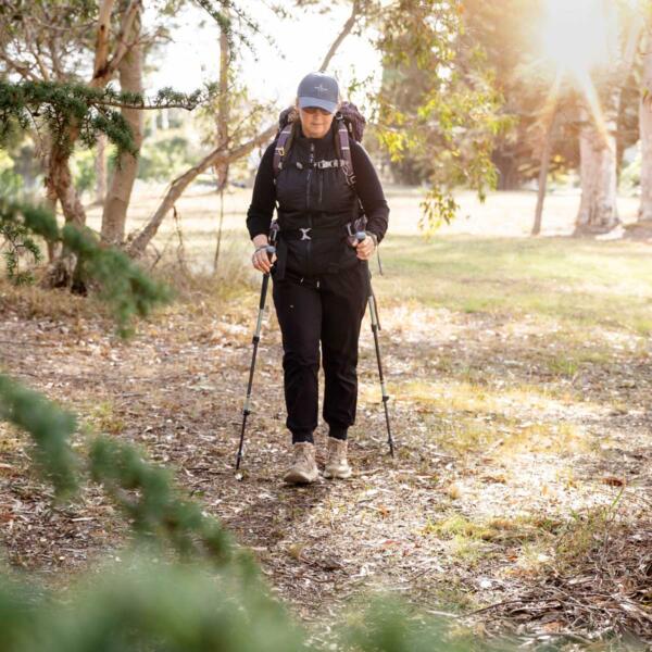 Woman with hiking poles in Geelong having received hiking boot advice from Total Care Podiatry podiatrists