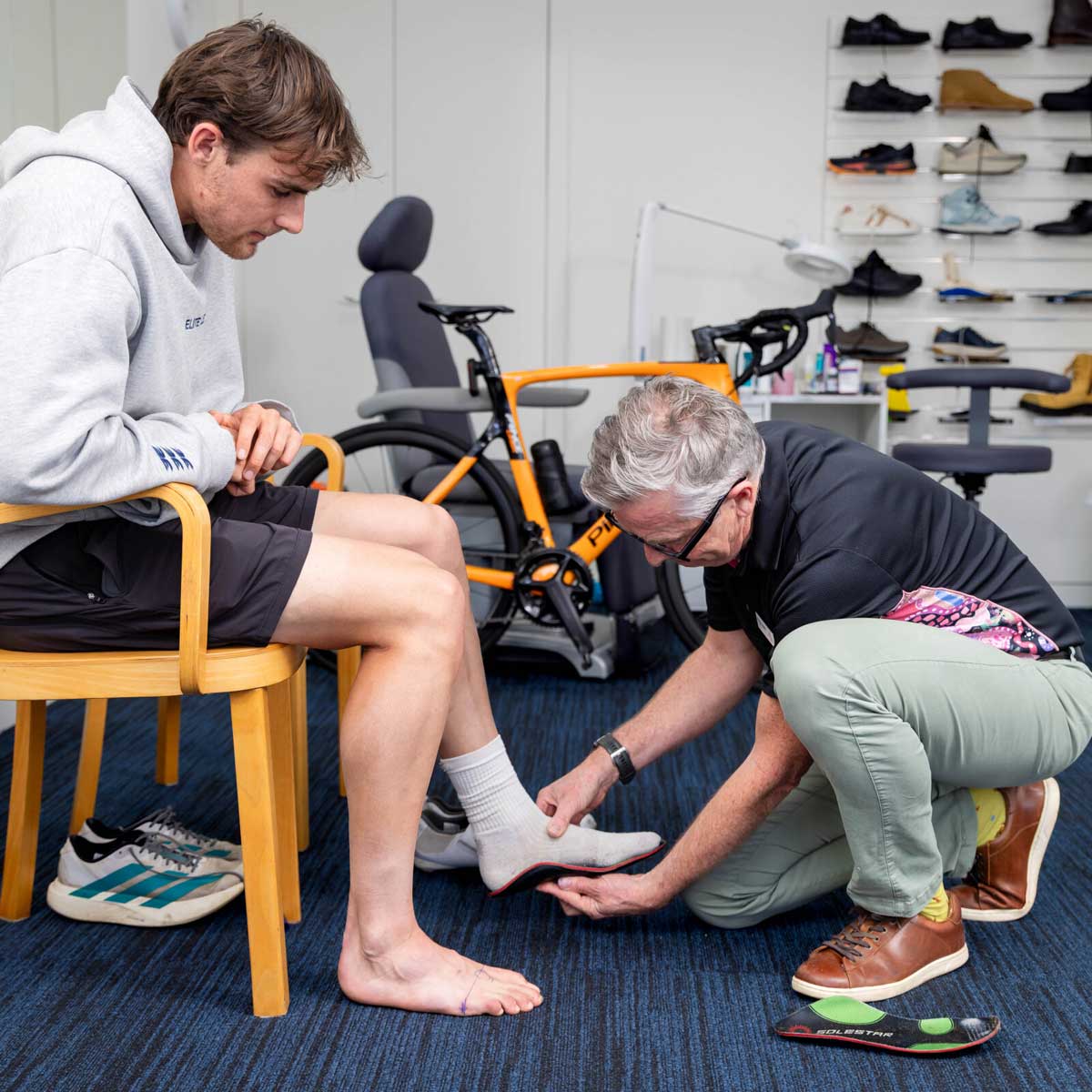 Total Care Podiatry Geelong podiatrist fitting a client with custom orthotics