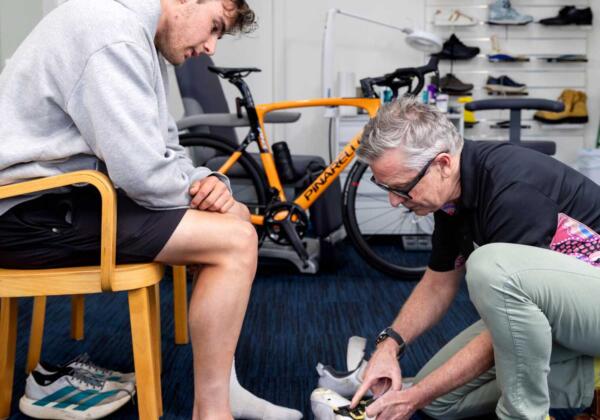 Total Care Podiatry Geelong podiatrist conducting cycling shoe fitting to fit cycling orthotics