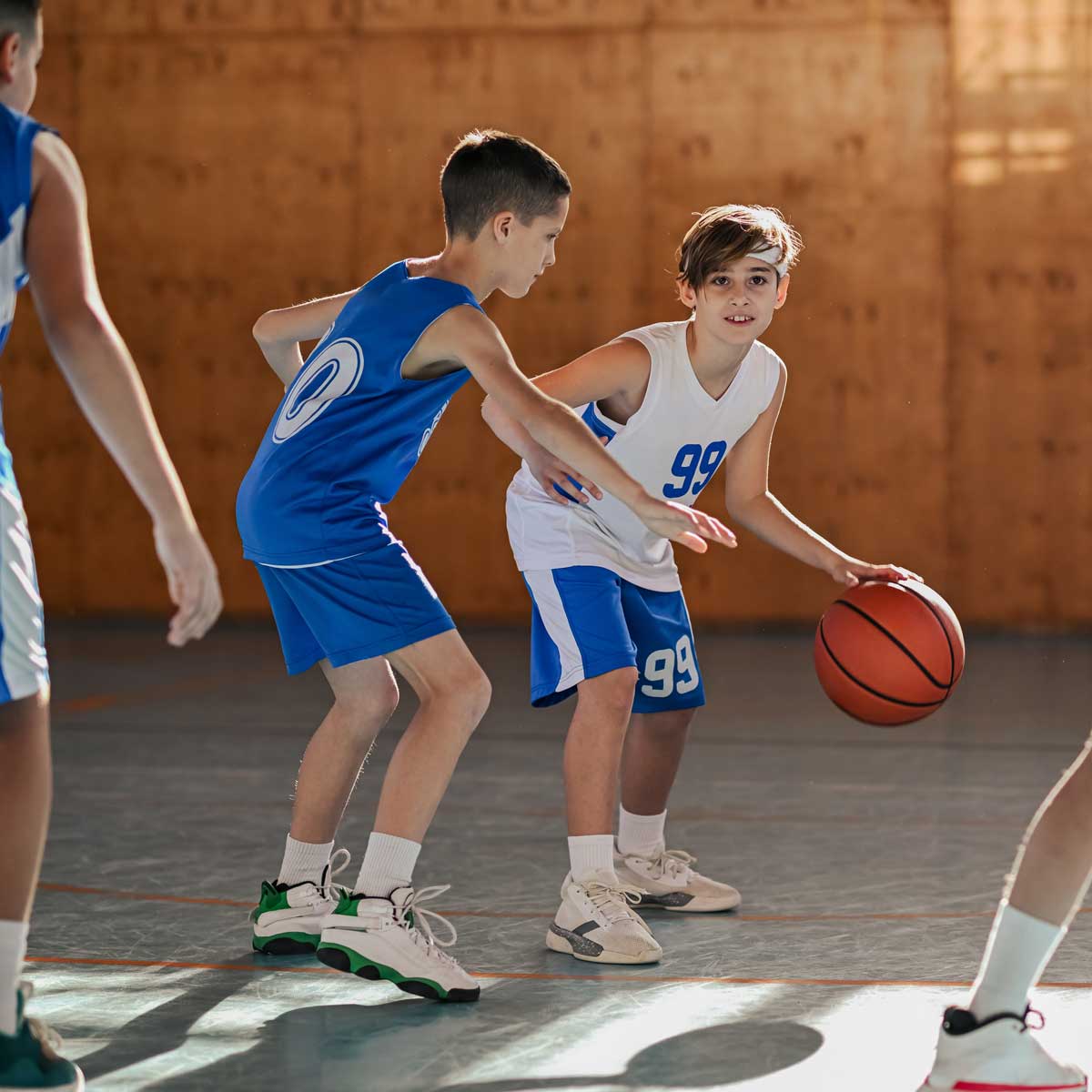 Young basketballers playing ball